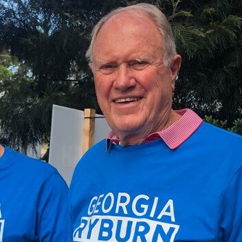 Retired federal and state Liberal minister, Bruce Baird, was handing out how-to-vote pamphlets for the Liberal candidate in the Pittwater by-election, Georgia Ryburn at Warriewood. Picture: Jim O’Rourke.