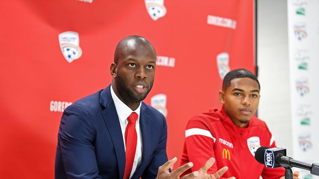 Adelaide United football director Bruce Djite with Reds visa player Michael Maria.