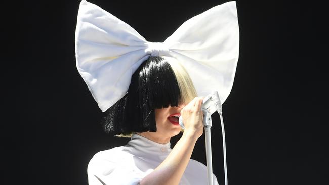 Sia is rarely seen without her signature kooky headwear. Photo: Stuart C. Wilson/Getty Images