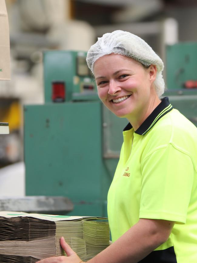 An SA Detpak employee with the Woolworths 'Made in Aus' 20c paper bags. Picture: Supplied.