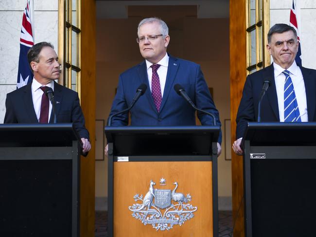 (L-R) Australian Health Minister Greg Hunt, Australian Prime Minister Scott Morrison and Australia's Chief Medical Officer Professor Brendan Murphy speak to the media during a press conference at Parliament House in Canberra, Wednesday, March 11, 2020. (AAP Image/Lukas Coch) NO ARCHIVING