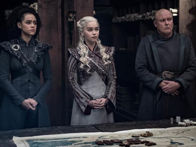 The coffee culprit has been revealed. Emilia Clarke (C) says it was Conleth Hill who played Varys (R). Picture: Helen Sloan/HBO