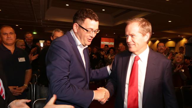 Federal Labor Opposition Leader Bill Shorten is greeted by Victorian leader Daniel Andrews, who has criticised former premier John Brumby over his stance on the GST, at the ALP conference at the weekend.