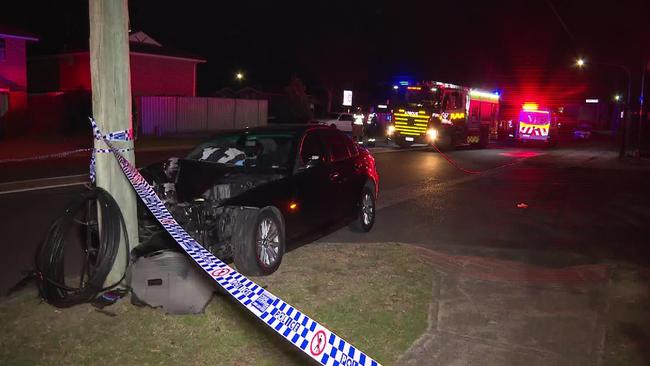 Three people were injured after a car crashed into a pole on Leacocks Lane, Casula on Sunday night. Picture: Supplied