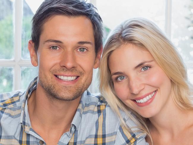 A happy couple discussing their finances together. Picture: iStock.