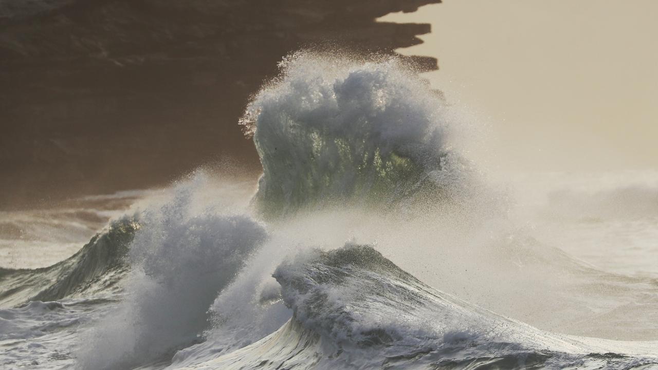 Wave height dropped overnight on Sydney’s coast but it was still ferocious at Bronte on Tuesday. Picture: John Grainger