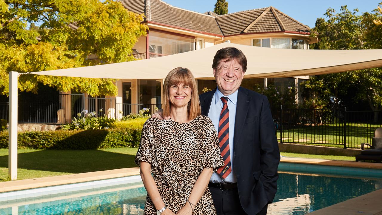 Sandra and Greg Griffin poses for a picture in-front of their house for sale in St Georges. Picture: MATT LOXTON
