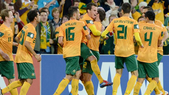 Socceroos players celebrate after scoring against Japan in their World Cup qualifier in Brisbane in 2012.