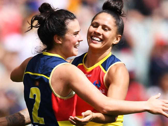 I love this team: Stevie-Lee Thompson celebrate a goal with Eloise Jones during the Crows demolition of Geelong by 11 goals in Sunday’s preliminary final. Picture: Mark Brake/Getty Images