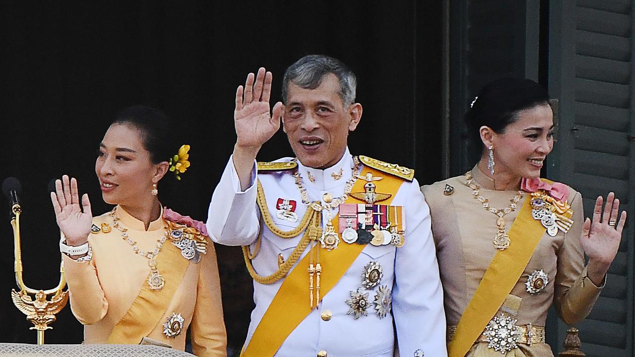 Thailand's King Maha Vajiralongkorn with Queen Suthida and his daughter Princess Bajrakitiyabha Mahidol. Picture: Jewel Samad/AFP