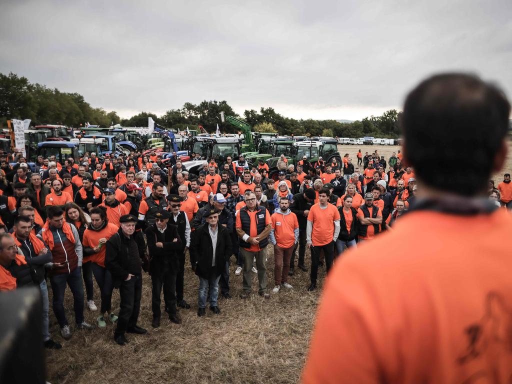 China has retaliated by launching probes into European brandy, dairy and pork products. Furious winegrowers are pictured above protesting the move, which has seen them caught in the crossfires and facing ruin. Picture: Thibaud MORITZ / AFP)