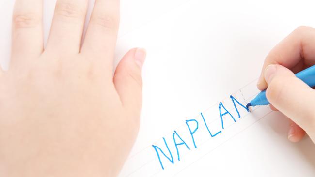 Naplan is an Australian Standardised Test that most school children go through. In this image, preschool child tracing the word NAPLAN. Font used for tracing is my own design,