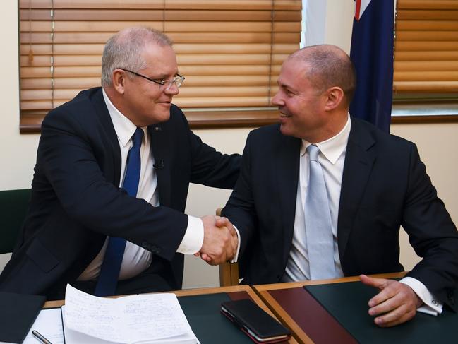 Josh Frydenberg, with Prime Minister Scott Morrison, believes the banks should pass on “the benefits of sustained reductions in funding costs”. Picture: AAP