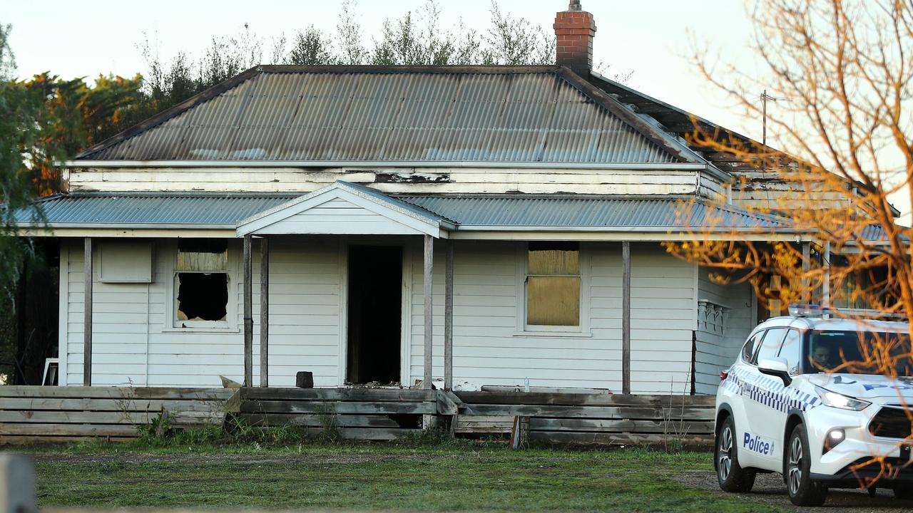 Police guarding a vacant house on Boundary Rd in Armstrong Creek after it caught fire. Picture: Alison Wynd