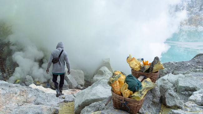 A miner prepares to descend into the Ijen volcano crater. Picture: Filippo Falco