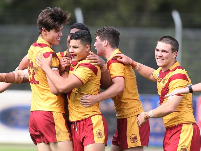 Holy Cross Ryde celebrate a try in its 30-12 win over All Saints.  All the action in the NRL Schoolboy Cup match between All Saints College and Holy Cross at Cessnock Sportsground. Picture by Peter Lorimer