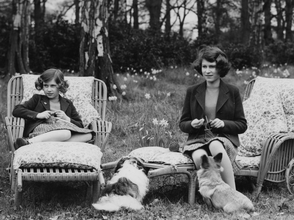 The two princesses knitting for the forces in the grounds of the Royal Lodge in Windsor Great Park, April 1940. Picture: Lisa Sheridan/Studio Lisa/Hulton Archive/Getty Images