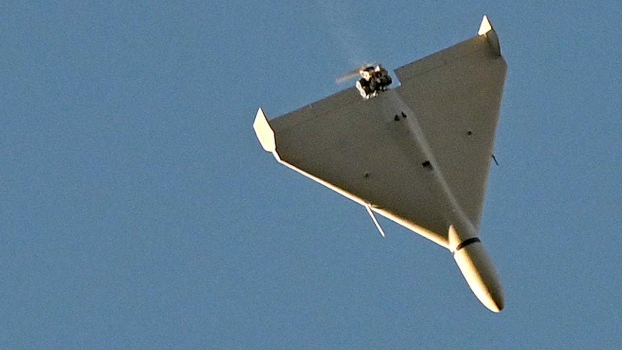 A drone flies over Kyiv during an attack on October 17. (Photo by Sergei SUPINSKY / AFP)