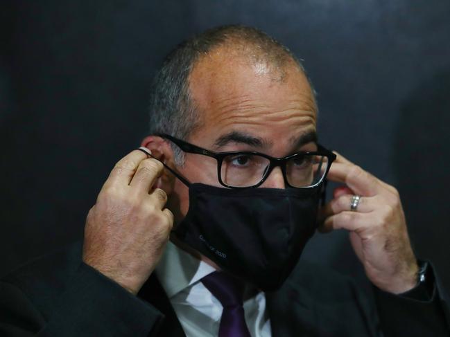 Victorian acting premier James Merlino puts on his face mask. Picture: NCA NewsWire / David Crosling