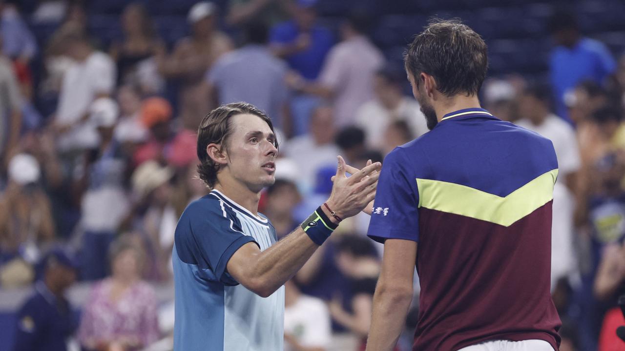 NEW YORK, NEW YORK – SEPTEMBER 04: Daniil Medvedev of Russia embraces Alex de Minaur of Australia.