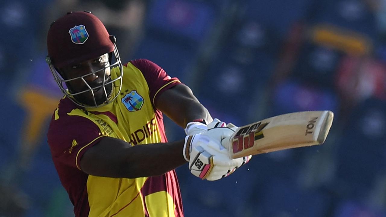 West Indies' Andre Russell plays a shot during the ICC menâ&#128;&#153;s Twenty20 World Cup cricket match between Australia and West Indies at the Sheikh Zayed Cricket Stadium in Abu Dhabi on November 6, 2021. (Photo by INDRANIL MUKHERJEE / AFP)