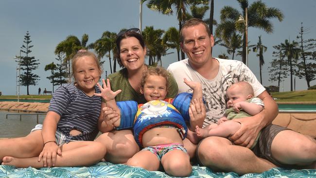 Jade and Michael Mansey with Georgia, 8, Lily, 2, and Xander, 6 months, from the Sunshine Coast enjoy the rock pool on the Strand. Picture: Evan Morgan