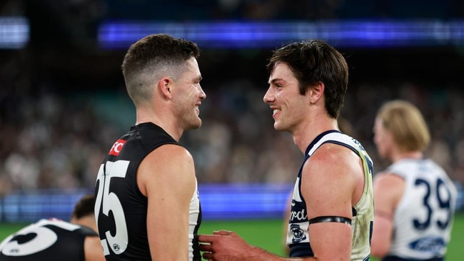 Ollie Henry speaks with Jack Crisp after his first meeting with the Pies as a Cat in 2023 Picture: Dylan Burns/AFL Photos via Getty Images