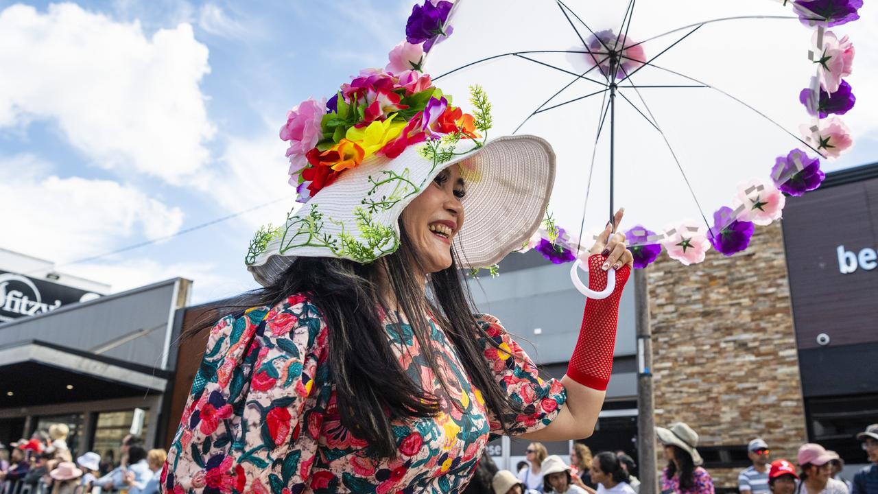 Uyen Vuong reacts to the crowd while walking with the Vietnamese community float during the Grand Central Floral Parade of Carnival of Flowers 2022, Saturday, September 17, 2022. Picture: Kevin Farmer