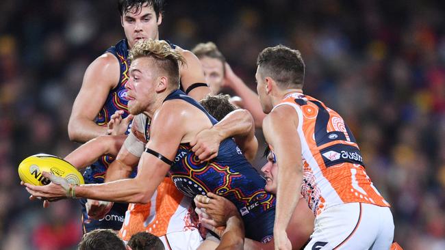 Hugh Greenwood busts through traffic against Greater Western Sydney. Picture: AAP Image/David Mariuz