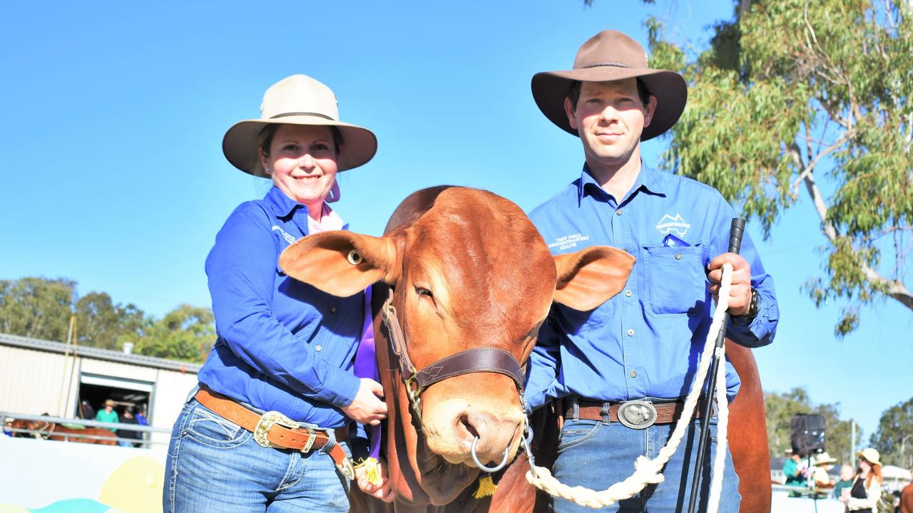 View Field Droughtmasters owners Shane and Sarah Hauschildt with their winning Droughtmaster bull junior bull at the Gatton Show on Saturday. (View field Galilee 18 months old Junior Champion Droughtmaster Bull.) Picture: Peta McEachern