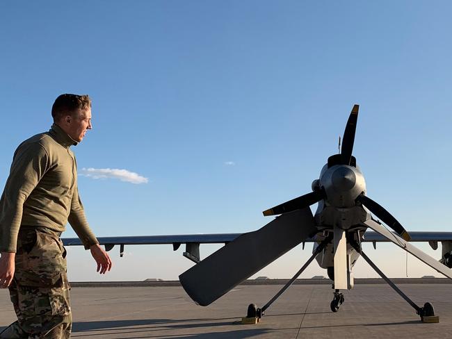 A US soldier walking past a drone at the Ain al-Asad air base in the western Iraqi province of Anbar. Picture: AFP