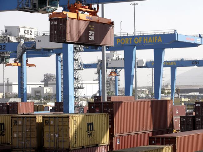 A cargo crane moves a shipping container on the quay side at the Port of Haifa in Haifa, Israel, on Sunday, Nov. 13, 2011. Turkey bought 3 percent of all Israel's exports in the year to August, making the market worth $1.3 billion. Photographer: Ariel Jerozolimski/Bloomberg