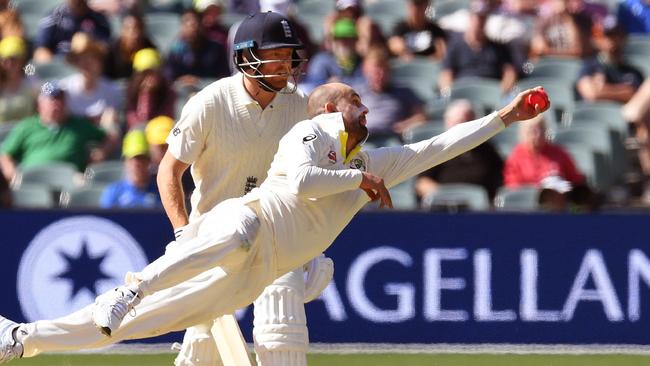 Australian spinner Nathan Lyon launches himself to remove England’s Moeen Ali off his own bowling on Monday.