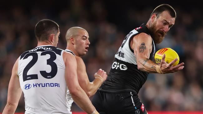 ADELAIDE, AUSTRALIA - MAY 30: Charlie Dixon of the Power and Jacob Weitering of the Blues during the 2024 AFL Round 12 match between the Port Adelaide Power and the Carlton Blues at Adelaide Oval on May 30, 2024 in Adelaide, Australia. (Photo by Sarah Reed/AFL Photos via Getty Images)