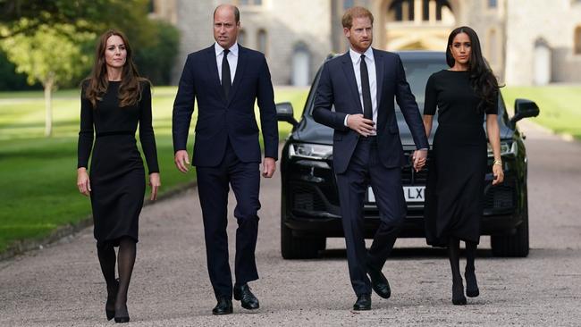 Catherine, William, Harry and Meghan emerge from Windsor Castle to greet crowds gathered to pay their respects following the death of the Queen. Picture: Getty Images