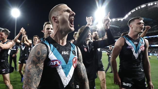 Hamish Hartlett screams into the crowd after beating the Cats. Picture: Ryan Pierse/Getty Images