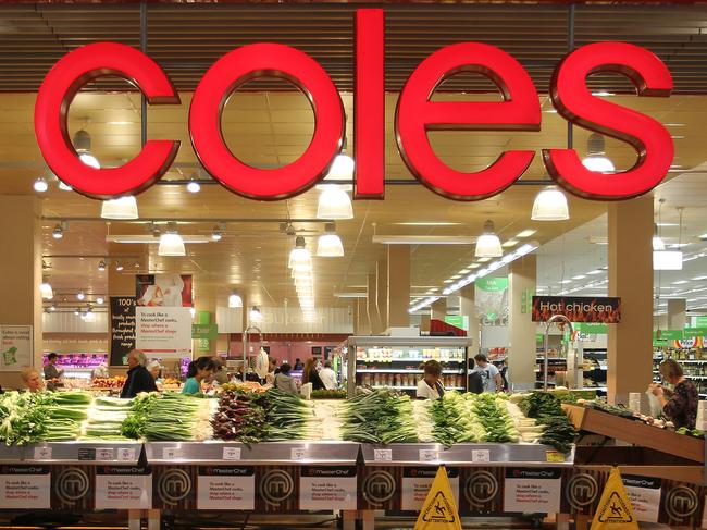 26/07/2010 BUSINESS: Shoppers look through the produce at a Coles supermarket in Perth, Australia, on Monday, July 26, 2010. Wesfarmers Ltd., Australia's second-largest retailer, said sales at its Coles unit rose in the fourth quarter as the division's convenience stores and revamped fresh food areas in supermarkets drew more customers. Photographer: Tony Ashby/Bloomberg