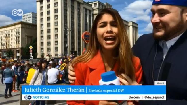 The fan runs up to TV reporter Julieth Gonzalez Theran.