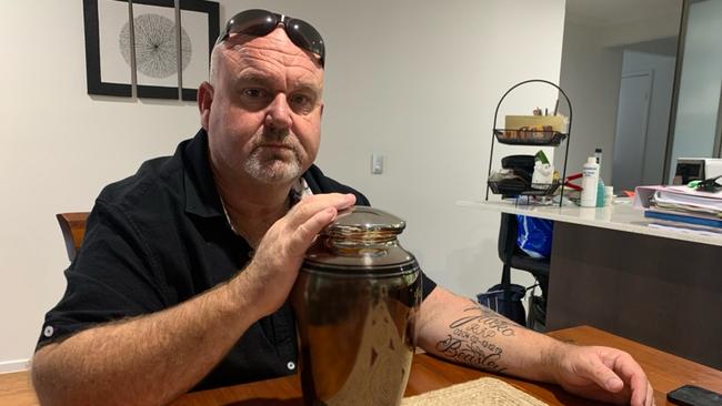 Brett Beasley with his son's urn.