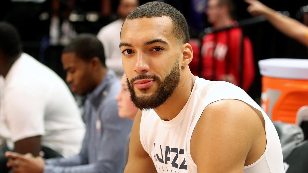 (FILES) In this file photo taken on December 4, 2019 Utah Jazz center Rudy Gobert cools down after warm ups before a NBA game against Los Angeles Lakers in Salt Lake City, Utah. - Some celebrities around the world are affected by the novel coronavirus such as Rudy Gobert. He has been tested positive to the Covid-19. (Photo by GEORGE FREY / AFP)