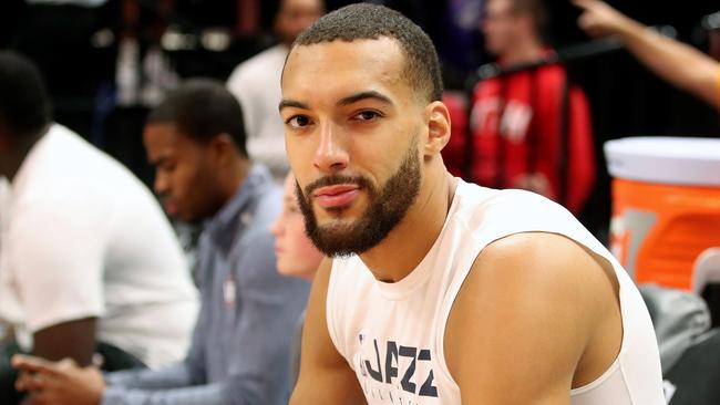 (FILES) In this file photo taken on December 4, 2019 Utah Jazz center Rudy Gobert cools down after warm ups before a NBA game against Los Angeles Lakers in Salt Lake City, Utah. - Some celebrities around the world are affected by the novel coronavirus such as Rudy Gobert. He has been tested positive to the Covid-19. (Photo by GEORGE FREY / AFP)