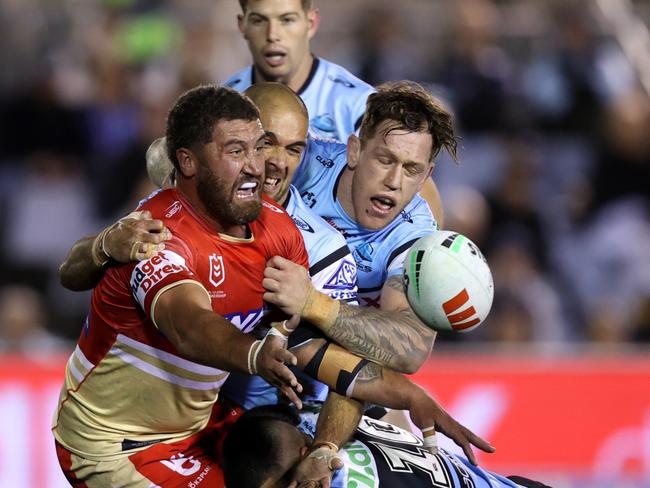 SYDNEY, AUSTRALIA - JUNE 13: Kenneath Bromwich of the Dolphins offloads the ball during the round 15 NRL match between Cronulla Sharks and Dolphins at PointsBet Stadium, on June 13, 2024, in Sydney, Australia. (Photo by Jason McCawley/Getty Images)