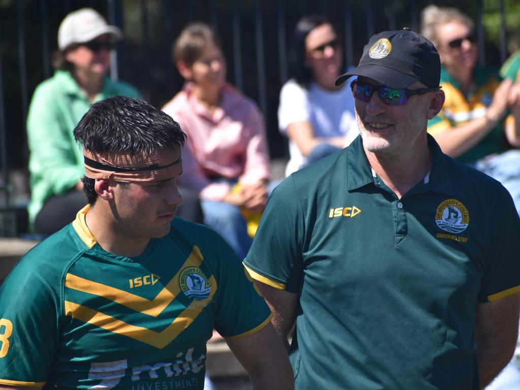 St Brendan's First XIII coach Scott Minto with star forward Carter Ford.