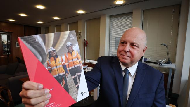 Victorian Treasurer Tim Pallas in his office with the 2022-2023 State Budget report. Picture: David Caird