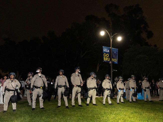 Police officers stand guard after clashes erupted on the campus of the University of California in Los Angeles. Picture: AFP