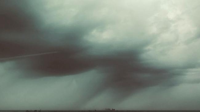 The Melbourne CBD is barely visible as the rain sets in. Picture: Michael Featherston