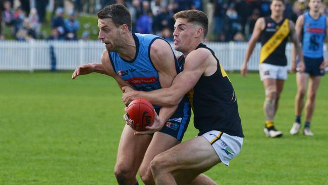 Glenelg’s Carl Nicholson lays a strong tackle in his comeback game against Sturt. Picture: BRENTON EDWARDS (AAP).