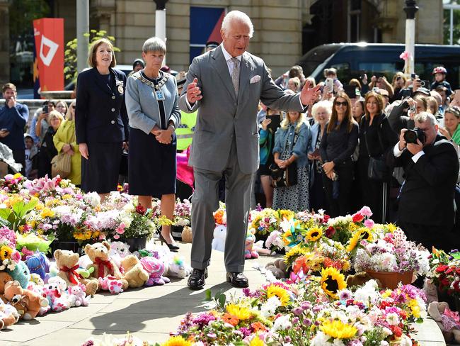 King Charles views tributes to the slain children of the Southport knife attack. Picture: AFP