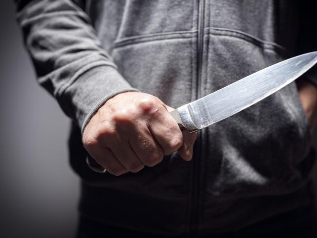 Generic crime Istock  -  Criminal with knife weapon threatening to stab