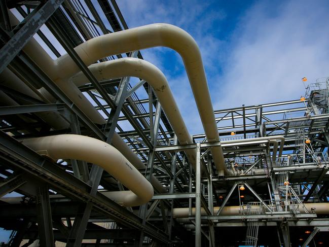 Gas pipes run through a plant at the Queensland Curtis Liquefied Natural Gas (QCLNG) project site, operated by QGC Pty, a unit of Royal Dutch Shell Plc, in Gladstone, Australia, on Wednesday, June 15, 2016. Gas from more than 2,500 wells travels hundreds of miles by pipeline to the project, where it's chilled and pumped into 10-story-high tanks before being loaded onto massive ships. Photographer: Patrick Hamilton/Bloomberg